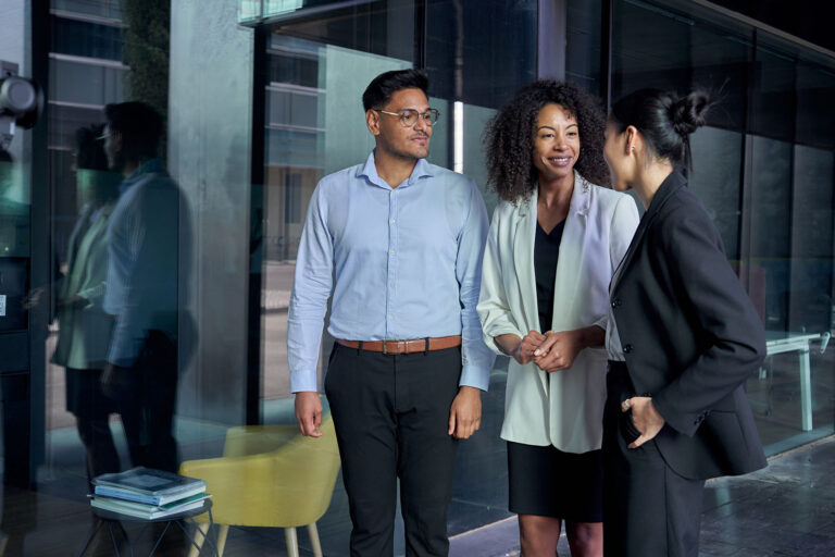 Team meeting three different professional listening to unrecognizable Asian leader. Group staff suit